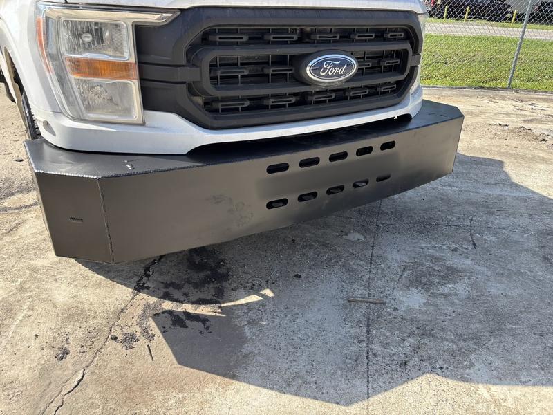 Black steel push bumper fabricated for a fleet truck