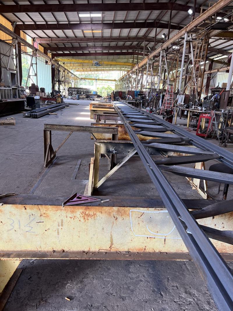 Steel truss being fabricated on the Griffis shop floor